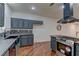 Well-equipped kitchen featuring stainless steel appliances, sleek countertops, stylish cabinets, and hardwood floors at 108 Broken Rock Dr, Henderson, NV 89074