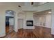 Charming living room featuring hardwood floors, a fireplace, and an open layout, perfect for entertaining and gatherings at 108 Broken Rock Dr, Henderson, NV 89074