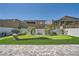 Well-maintained backyard boasts a putting green, mature palm trees, and an elegant water feature at 12438 Heritage Bend Dr, Las Vegas, NV 89138