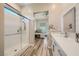 Contemporary bathroom featuring a glass-enclosed shower and sleek vanity at 12438 Heritage Bend Dr, Las Vegas, NV 89138