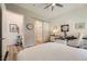 Well-lit bedroom with desk, barn door to bathroom, and stylish decor at 12438 Heritage Bend Dr, Las Vegas, NV 89138