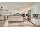 Spacious open-concept kitchen with island seating and stainless steel appliances at 12438 Heritage Bend Dr, Las Vegas, NV 89138