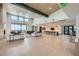 Expansive lounge area featuring soaring ceilings, modern furniture, and large windows with stunning views at 12438 Heritage Bend Dr, Las Vegas, NV 89138