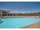 Enjoy the community pool with mountain views and ample seating for residents at 12438 Heritage Bend Dr, Las Vegas, NV 89138