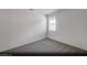 Empty bedroom with neutral walls, plush carpeting, and a bright window, ready for personalization at 129 Castanet Ln # Lot 190, Henderson, NV 89015