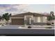 Beautiful home showcasing a well-manicured lawn, inviting entrance, and a convenient two-car garage at 129 Castanet Ln # Lot 190, Henderson, NV 89015