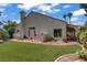 A backyard with grass, a white fence, and landscaping at 1305 Chaparral Summit Dr, Las Vegas, NV 89117