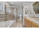 Luxurious bathroom with a soaking tub, glass shower, and dual vessel sinks at 1305 Chaparral Summit Dr, Las Vegas, NV 89117