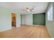 Spacious bedroom with hardwood floors and a ceiling fan for added comfort at 1305 Chaparral Summit Dr, Las Vegas, NV 89117