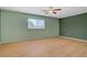 Bedroom featuring hardwood floors and a ceiling fan for added comfort at 1305 Chaparral Summit Dr, Las Vegas, NV 89117
