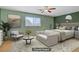 Stylish bedroom features light green walls, contemporary furnishings, and ample natural light at 1305 Chaparral Summit Dr, Las Vegas, NV 89117