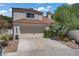 Charming two-story home with a tile roof and well-manicured landscaping at 1305 Chaparral Summit Dr, Las Vegas, NV 89117