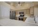 This kitchen has stainless steel appliances, a tile countertop, and a view of the backyard at 1305 Chaparral Summit Dr, Las Vegas, NV 89117