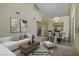 Bright living room with modern decor and an open floor plan to the dining area at 1305 Chaparral Summit Dr, Las Vegas, NV 89117