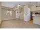 Bright living room with tile flooring, high ceilings, and decorative hanging lights at 1305 Chaparral Summit Dr, Las Vegas, NV 89117