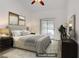 Serene main bedroom featuring neutral tones, a sliding glass door, and modern furnishings at 1305 Chaparral Summit Dr, Las Vegas, NV 89117