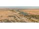 Expansive aerial view of the property and surrounding desert landscape, with mountains and the city skyline in the distance at 132 Soaring Sky Ave, Henderson, NV 89011