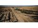 Vast aerial of the property, showcasing the desert landscape with a winding river and a view of the city in the distance at 132 Soaring Sky Ave, Henderson, NV 89011