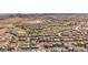 An aerial of a suburban neighborhood with mature trees and a golf course provides a picturesque living environment at 132 Soaring Sky Ave, Henderson, NV 89011