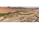 Scenic aerial view of the community nestled by a river and mountains, featuring homes with desert landscape surroundings at 132 Soaring Sky Ave, Henderson, NV 89011