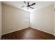 Bedroom features wood flooring, a window, and a ceiling fan at 132 Soaring Sky Ave, Henderson, NV 89011