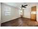 Bright bedroom with hardwood floors, a ceiling fan, and closet and storage cabinetry at 132 Soaring Sky Ave, Henderson, NV 89011