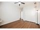 Bedroom features wood flooring, a ceiling fan, and a nearby closet at 132 Soaring Sky Ave, Henderson, NV 89011