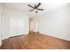 Spacious bedroom boasts wood flooring, a modern ceiling fan, and a convenient double door closet at 132 Soaring Sky Ave, Henderson, NV 89011