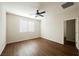 Bright bedroom with wood flooring, a modern ceiling fan, and a window for ample light at 132 Soaring Sky Ave, Henderson, NV 89011