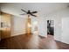Spacious bedroom with hardwood floors, built-in shelving, and views into the walk-in closet and bathroom at 132 Soaring Sky Ave, Henderson, NV 89011