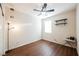 Cozy bedroom complete with wood floors, floating shelves, and a bright window view at 132 Soaring Sky Ave, Henderson, NV 89011