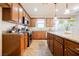 Well-equipped kitchen featuring stainless steel appliances, granite countertops, and stylish wood cabinets at 132 Soaring Sky Ave, Henderson, NV 89011