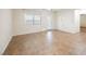 Open living room featuring tile flooring, a ceiling fan, and access to the backyard at 132 Soaring Sky Ave, Henderson, NV 89011