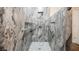 Spacious walk-in shower boasting modern tile design and convenient grab bars at 132 Soaring Sky Ave, Henderson, NV 89011