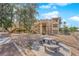Inviting condo exterior showcasing communal seating area and convenient access to units via exterior stairwells at 2007 Cutlass Dr # 0, Henderson, NV 89014