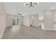 Spacious living room with sleek flooring, modern lighting, and access to the kitchen at 2007 Cutlass Dr # 0, Henderson, NV 89014