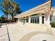Spacious back patio area with a covered walkway featuring elegant columns at 2017 Eagle Trace Way, Las Vegas, NV 89117