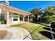 Lush backyard featuring palm trees and manicured green lawn, perfect for outdoor enjoyment at 2017 Eagle Trace Way, Las Vegas, NV 89117