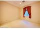 Neutral bedroom with large window and red curtains at 2017 Eagle Trace Way, Las Vegas, NV 89117