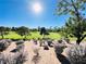 Scenic view of the golf course with beautiful desert landscaping and clear blue skies at 2017 Eagle Trace Way, Las Vegas, NV 89117