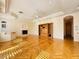 Large open living room featuring fireplace, custom built-ins, hardwood floors and recessed lighting at 2017 Eagle Trace Way, Las Vegas, NV 89117
