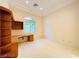 Well-lit office with carpet, neutral walls, built-in desk and shelving at 2017 Eagle Trace Way, Las Vegas, NV 89117