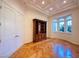 Stylish office with parquet floors, a built-in bookcase, and tray ceiling at 2017 Eagle Trace Way, Las Vegas, NV 89117