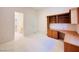 Inviting office area with built-in desk and shelving next to the doorway to the bathroom at 2017 Eagle Trace Way, Las Vegas, NV 89117