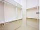 Walk-in closet with built-in shelving and bars for hanging clothes at 2017 Eagle Trace Way, Las Vegas, NV 89117