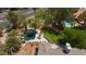 Aerial view of backyard featuring pool, lounge area, and lush landscaping at 2222 Lucerne Ct, Henderson, NV 89014