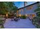 Private backyard patio with an outdoor dining set and mature trees at 2222 Lucerne Ct, Henderson, NV 89014