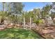Mature trees and lush vegetation provide shade and privacy in this backyard at 2222 Lucerne Ct, Henderson, NV 89014