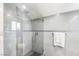 Modern bathroom featuring a glass shower with sleek tile and a rain shower head at 2222 Lucerne Ct, Henderson, NV 89014
