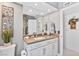 Bathroom featuring a vanity with a tan countertop, framed mirror, and accent decor at 2222 Lucerne Ct, Henderson, NV 89014